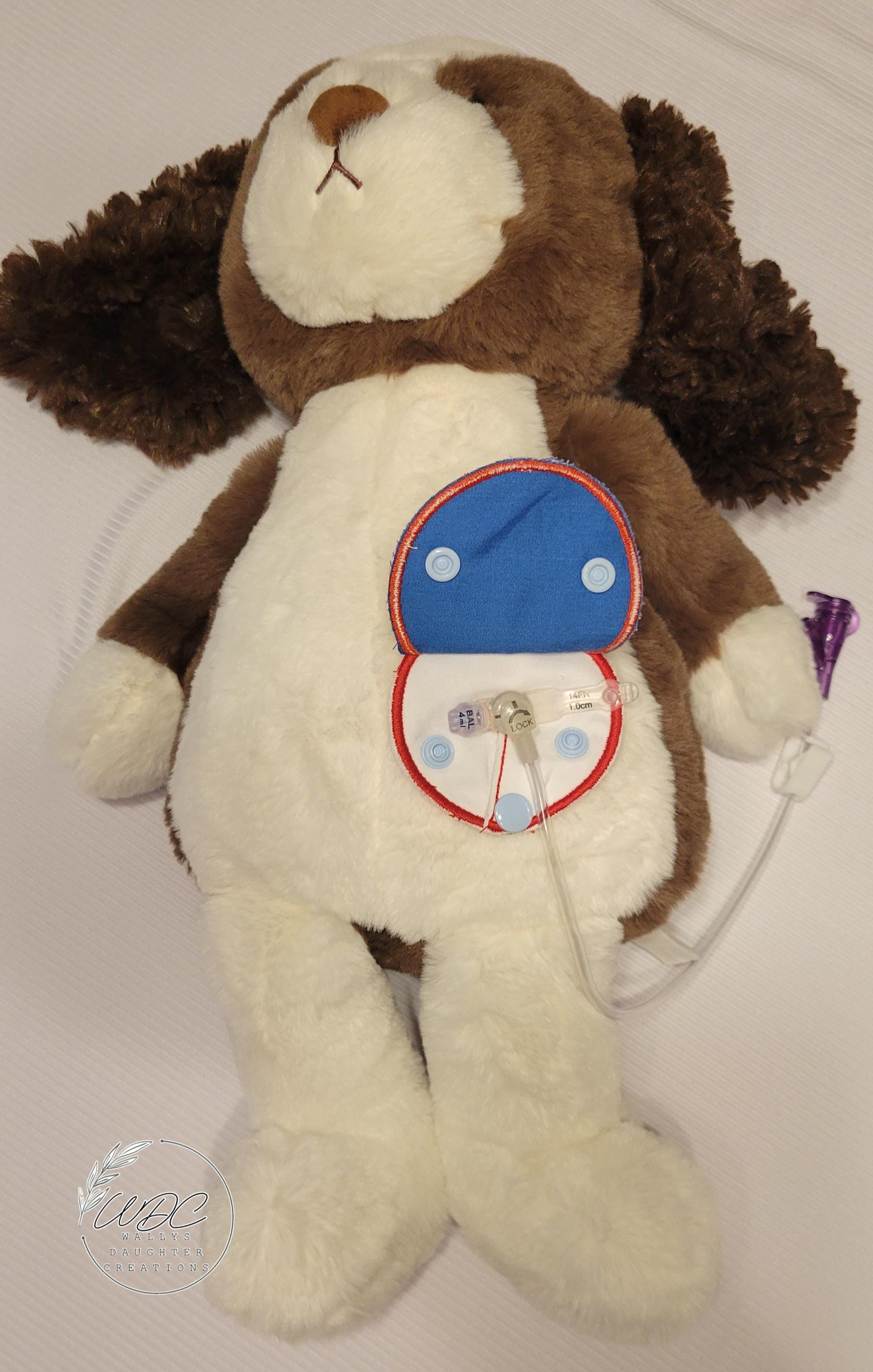 Stuffie with Snap down covered pad around an gtube with connected extension