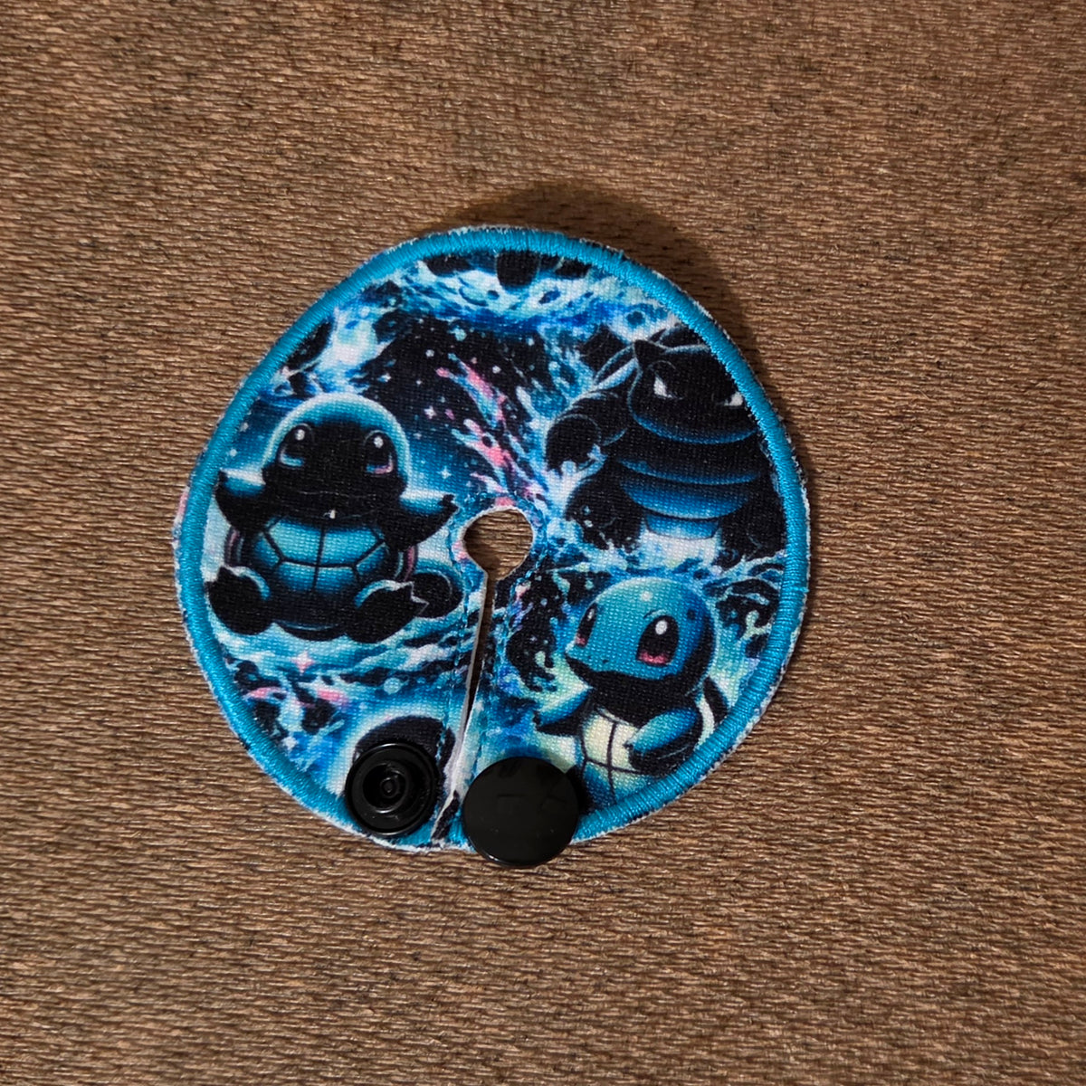 Mini gtube pad with neon blue Squirt Character and splashing water background