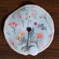 mini gtube pad in floral print with light teal background