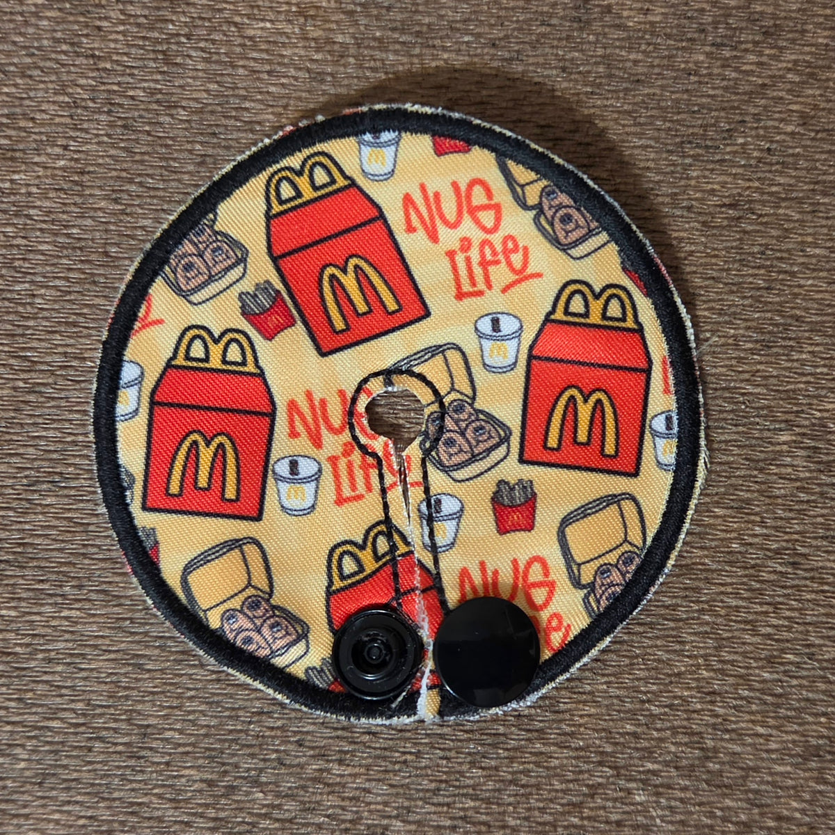 Nug Life Tube pad in mini version with red food boxes, nuggets and drink on yellow background