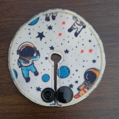 Mini gtube pad with astronauts on beige background