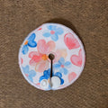 Mini gtube pad with pink and blue flowers, pink hearts on white background