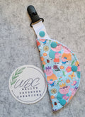 clip on port cover in a pig family character print
