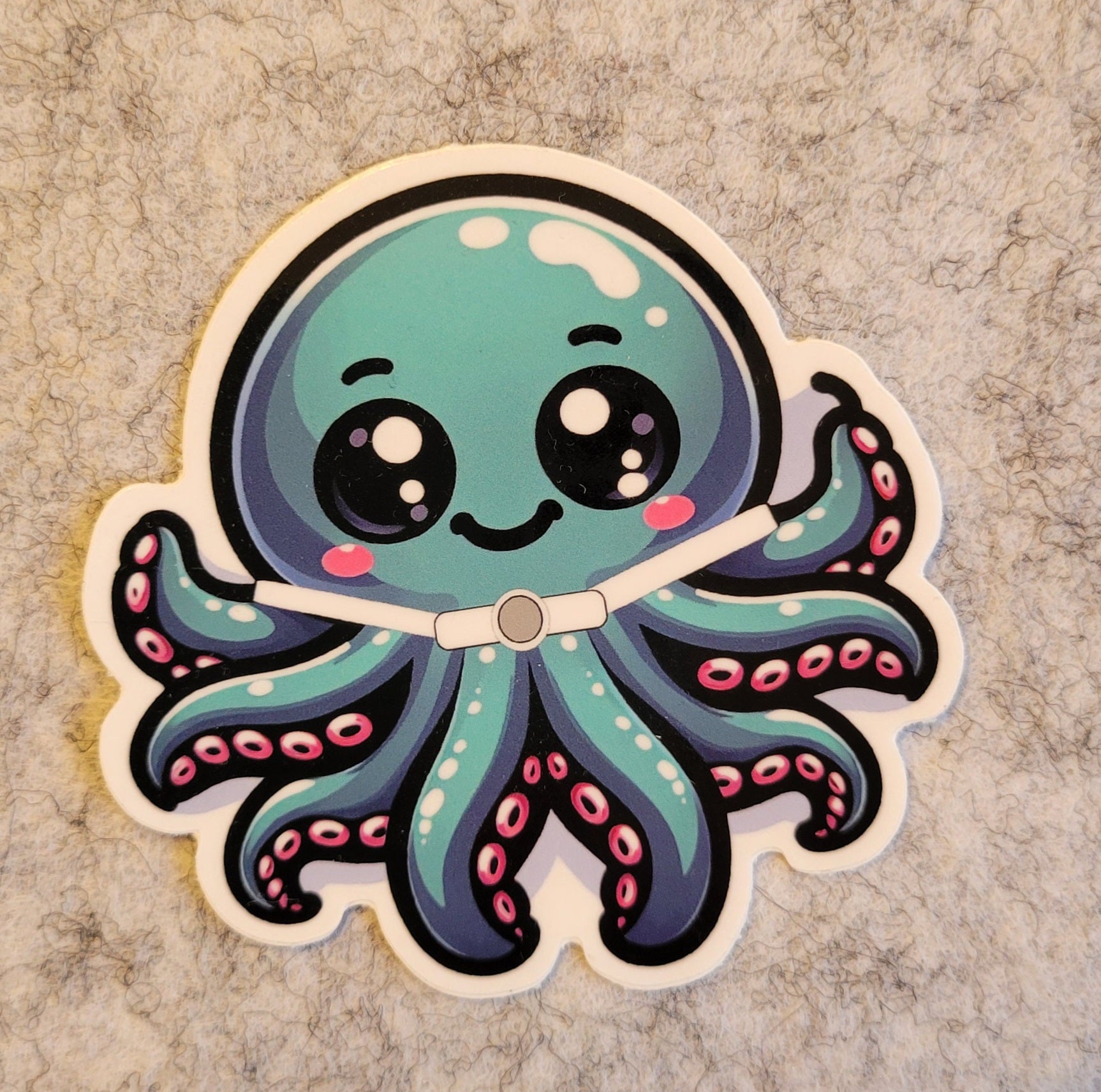 Cartoon octopus featuring a trach medical device sticker on a textured grey background