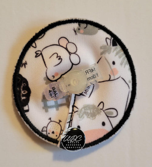 gtube pad with black and white farm animals