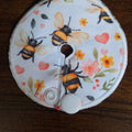 Gtube pad with bees and flowers with pink hearts on white background