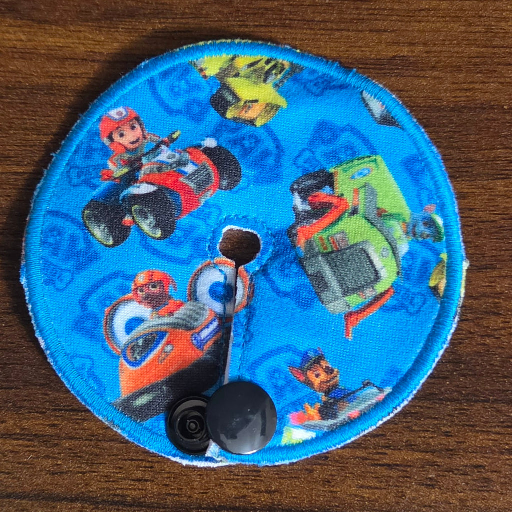 Pup characters with rescue vehicles on blue background