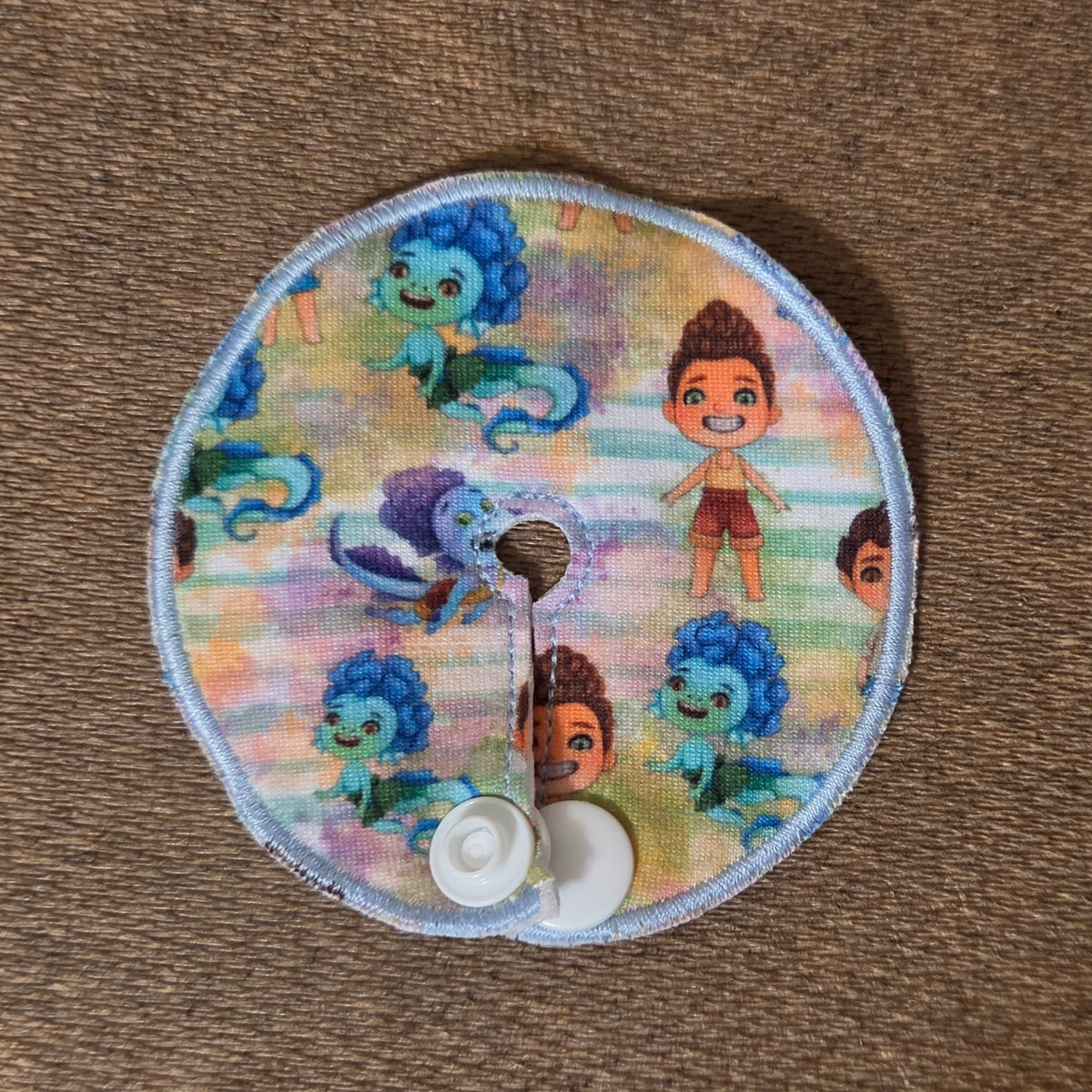 Sea Monster Boy gtube pad with watercolor stripe background