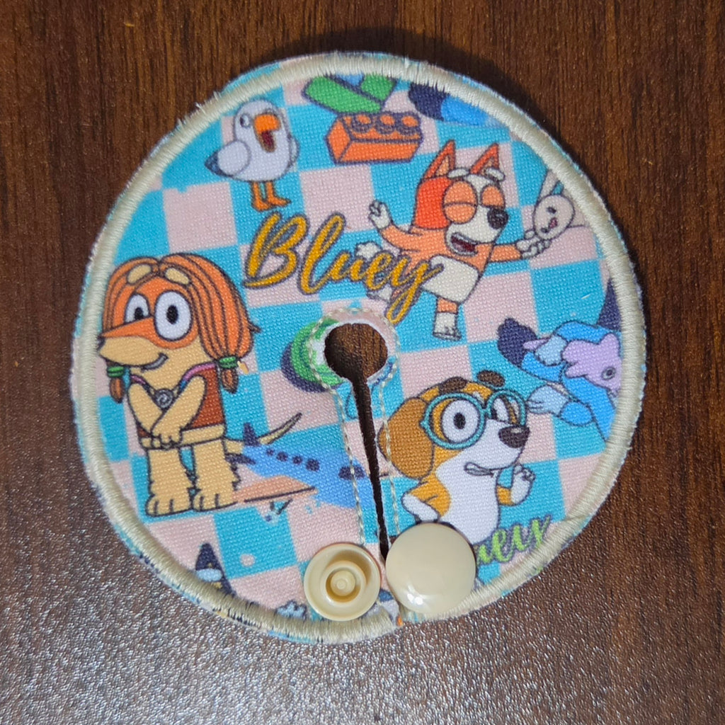 gtube pad with blue and tan checkerboard with Aussie dog characters