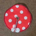 Red background with white polka dots gtube pad