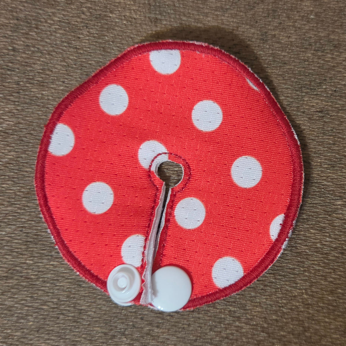 Red background with white polka dots gtube pad
