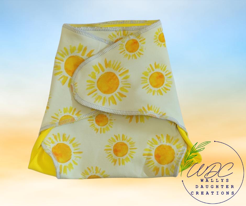 reuseable diaper with sunflower pattern on a gradient background
