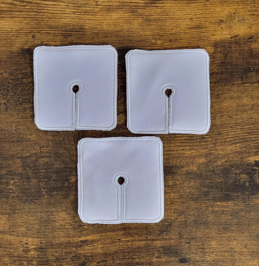 White Trach pad set of 3 on a wooden background