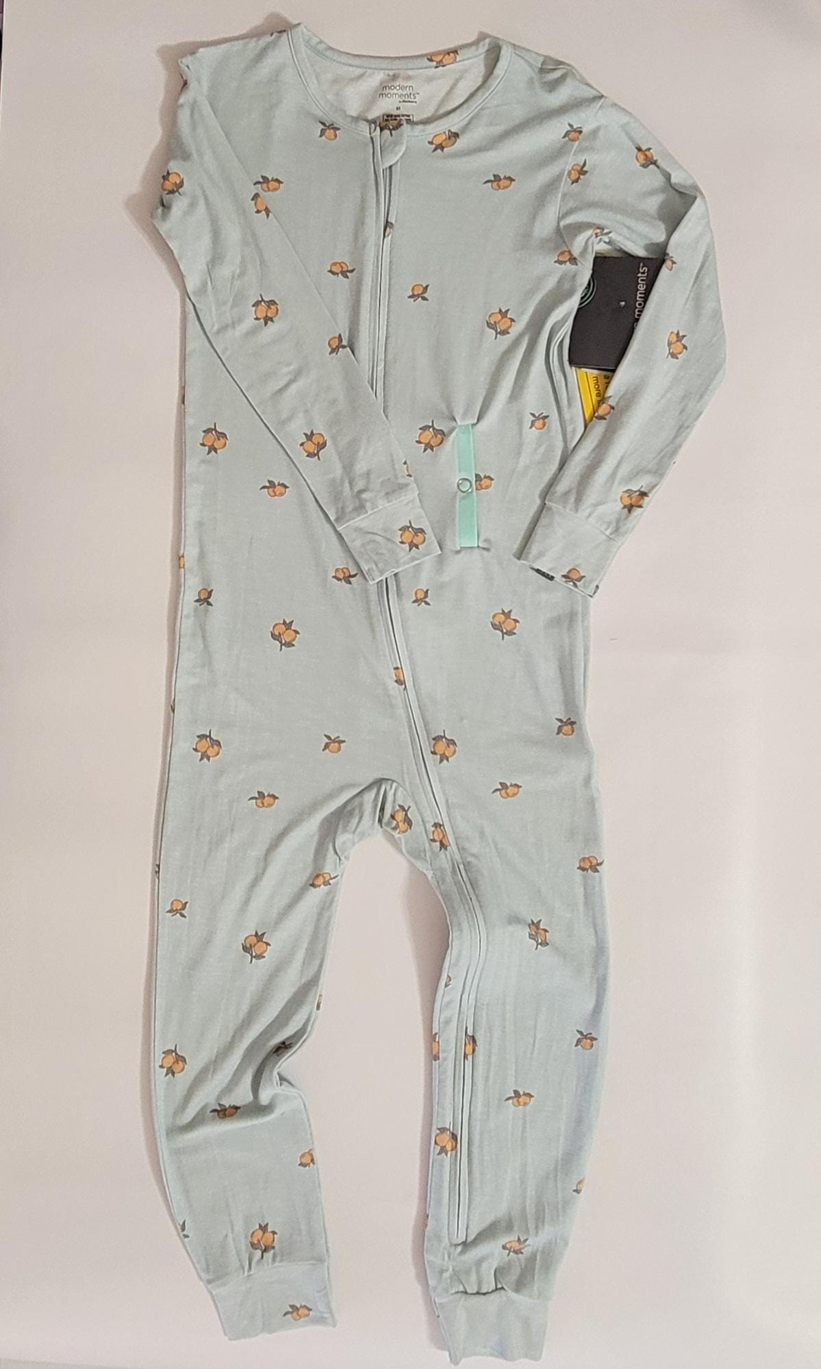 Light blue baby onesie with floral patterns on a white background
