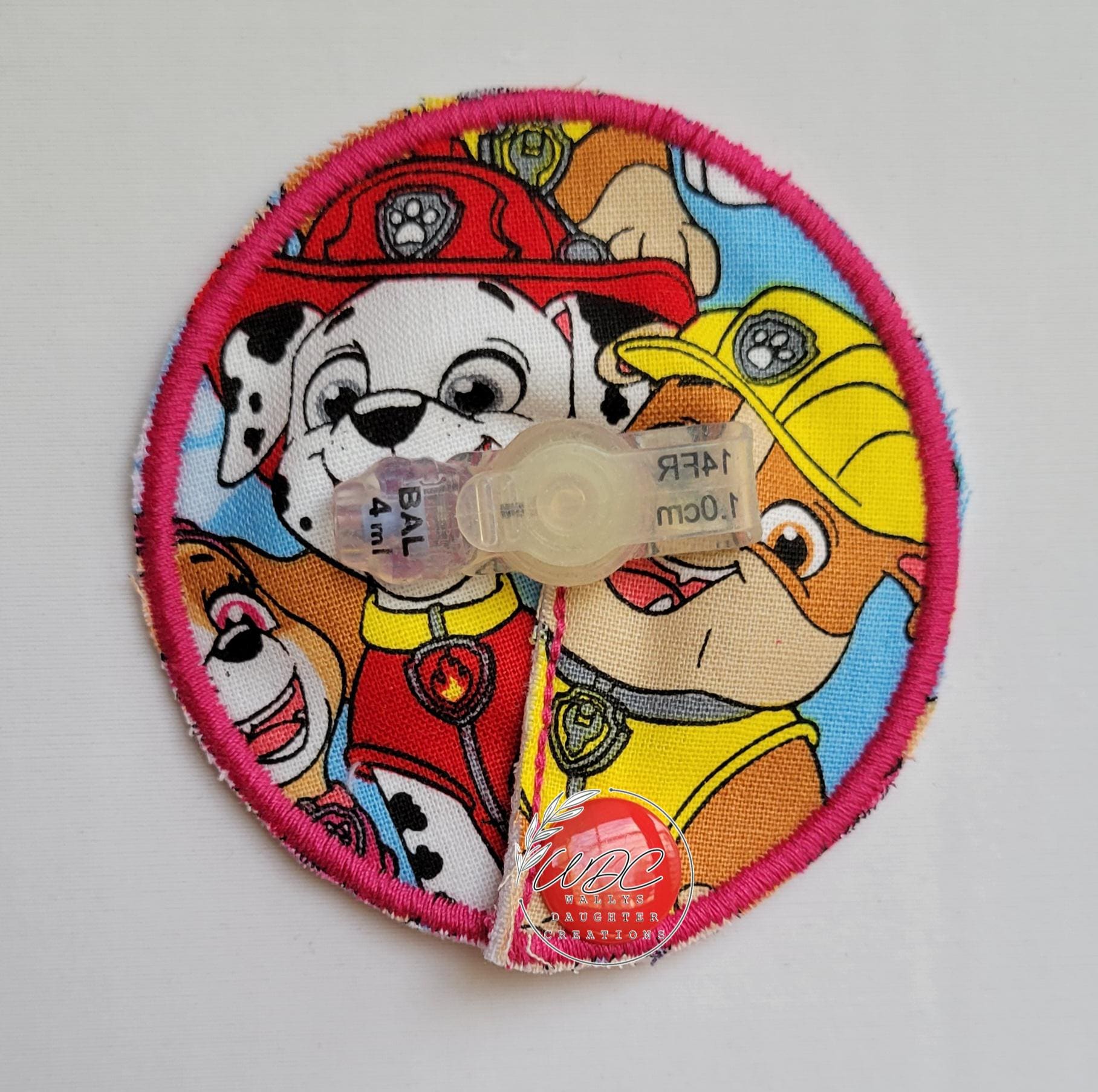 dog character tube pad in hot pink thread