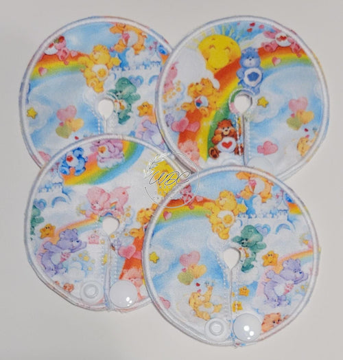 Four colorful gtube pads with cartoon characters on a white background