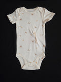 gtube adapted bodysuit with small cranes and chicks on a cream background