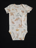 gtube adapted bodysuit with cranes and leaves on a cream background