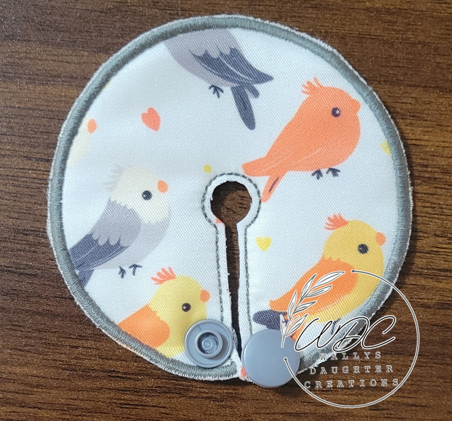 gtube pad with different colored cockatiel birds on white background