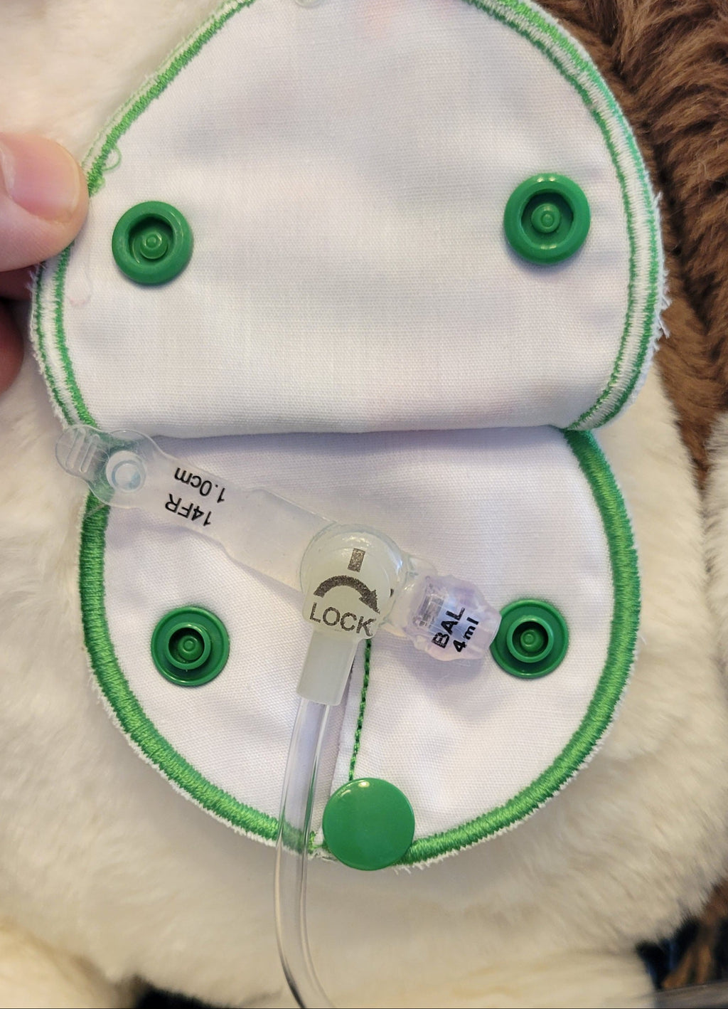 inside view of covered gtube pad on plush toy with gtube and extension