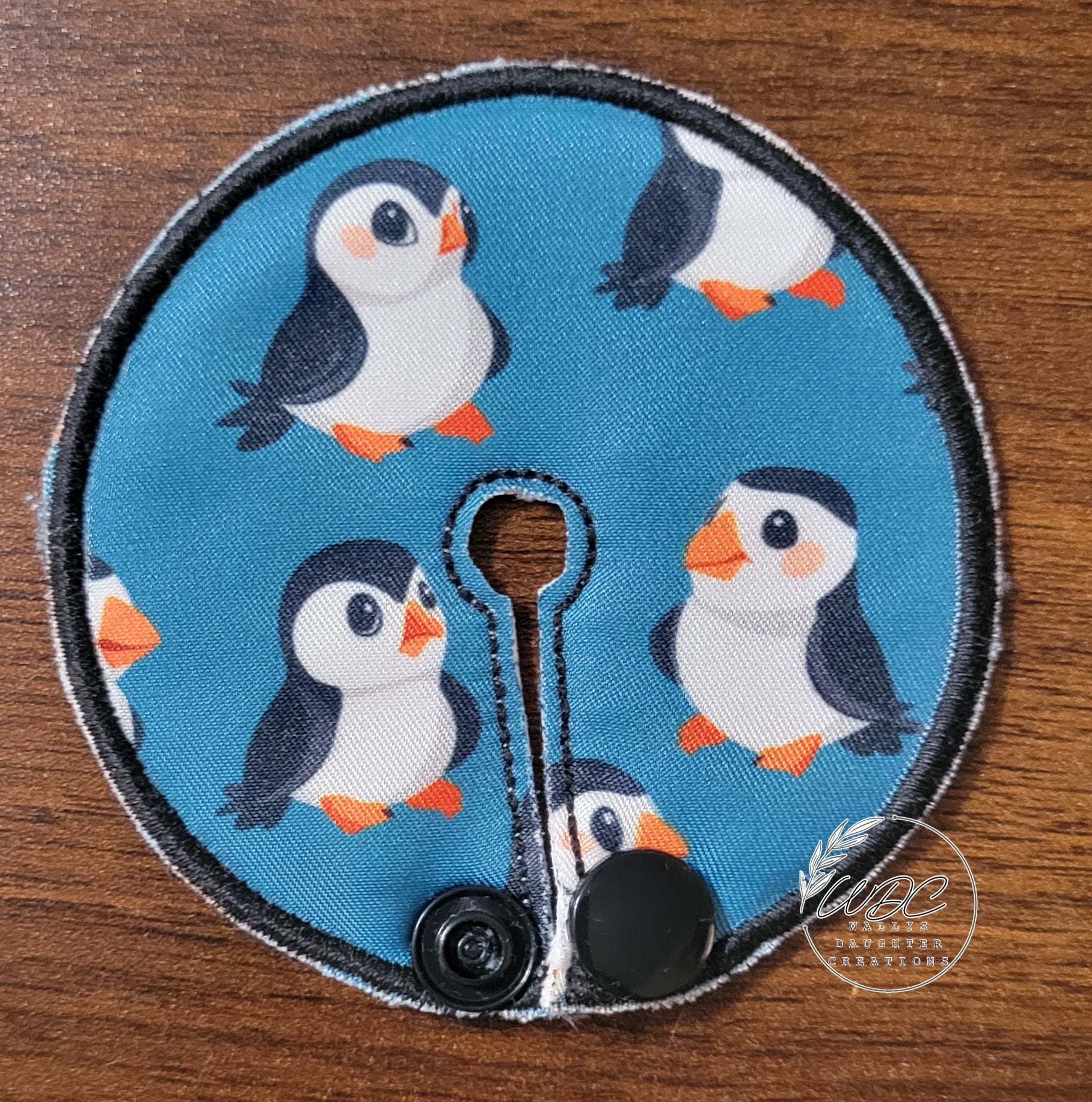 Gtube pad with penguin characters on blue background