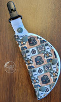 Clip on port cover in camping theme with compass, backpack and sign that reads Jesus loves me