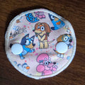 Snap down gtube pad with Aussie dog characters on beige background