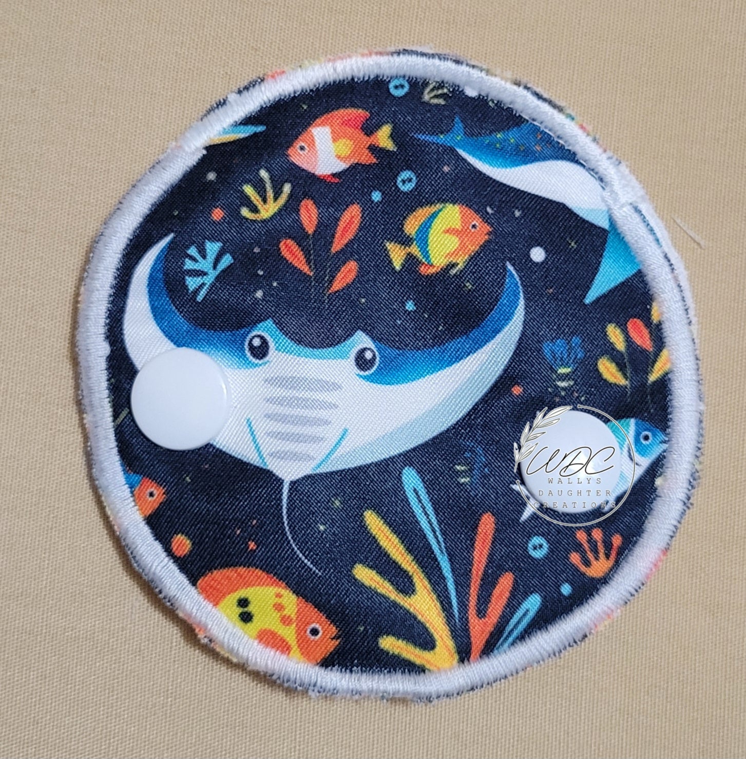 snap down covered pad with sting ray print