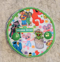 Covered Gtube pad with Sesame Street Characters
