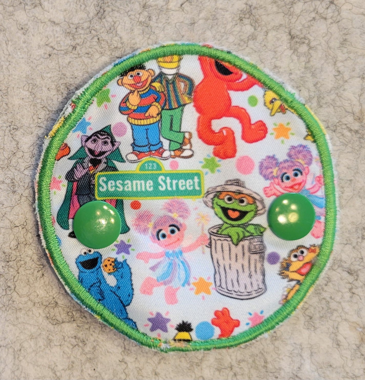 Covered Gtube pad with Sesame Street Characters