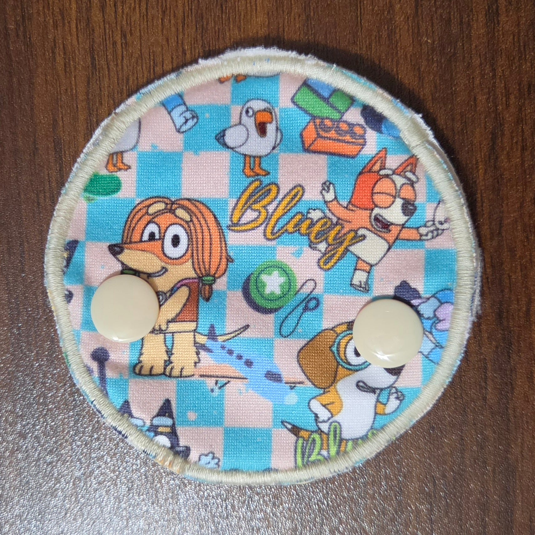 Snap down tube pad with blue aussie dog and friends characters
