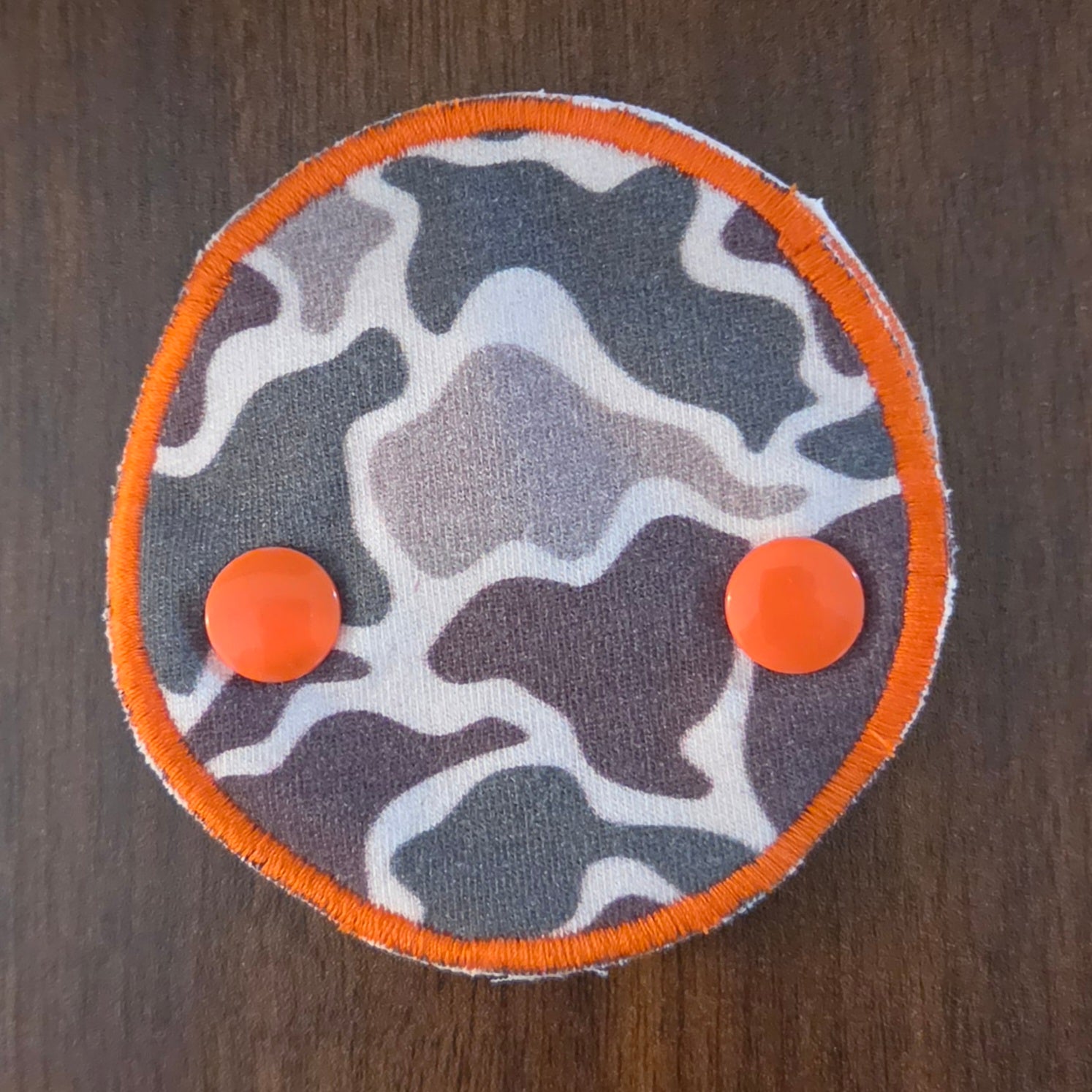 Cammo with orange trim snap down gtube pad