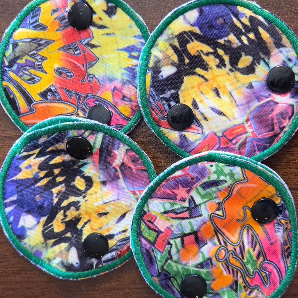 snap down covered gtube pads with street art print