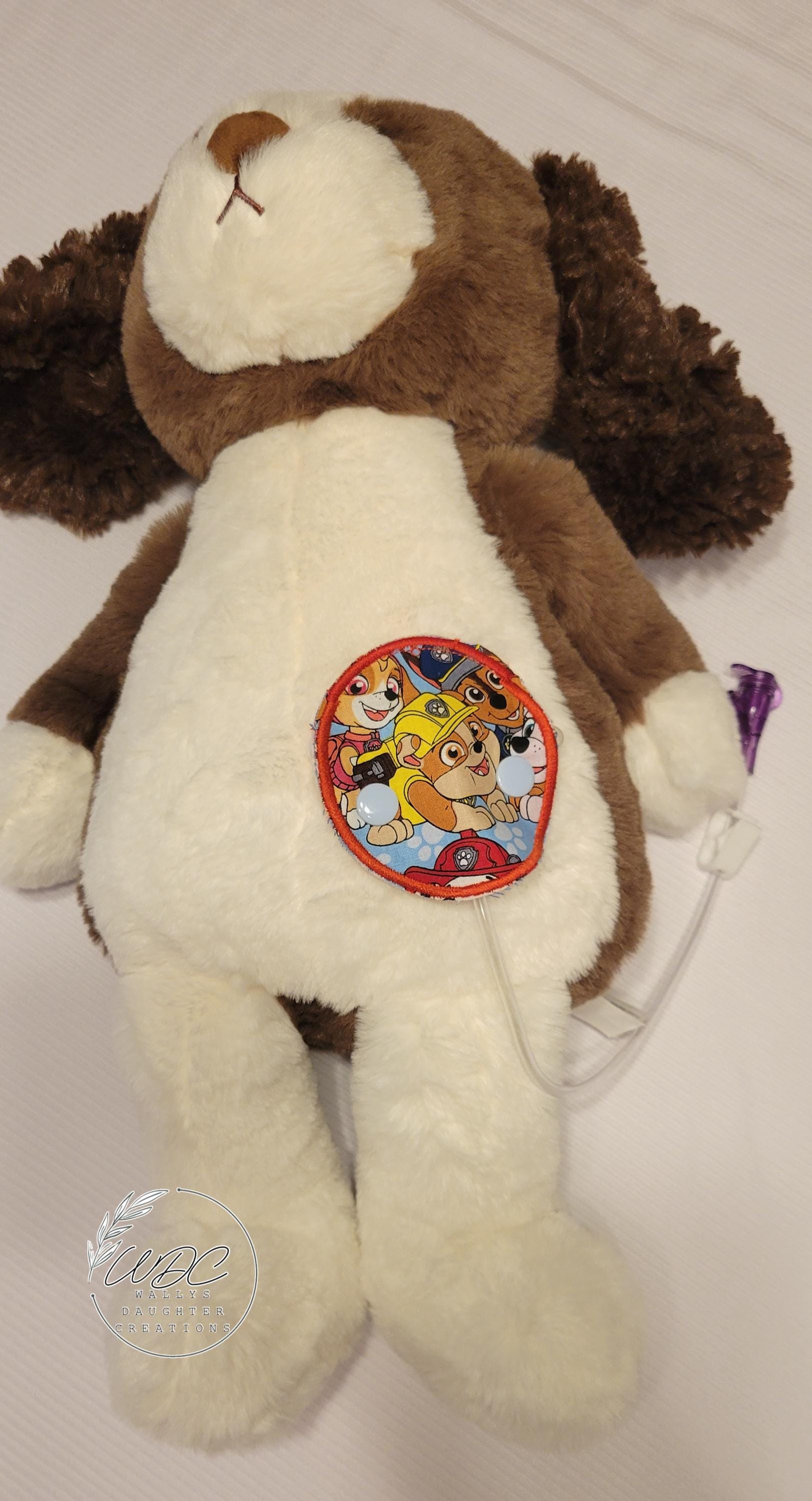 Snap down covered pad on a stuffie showing an extension 
