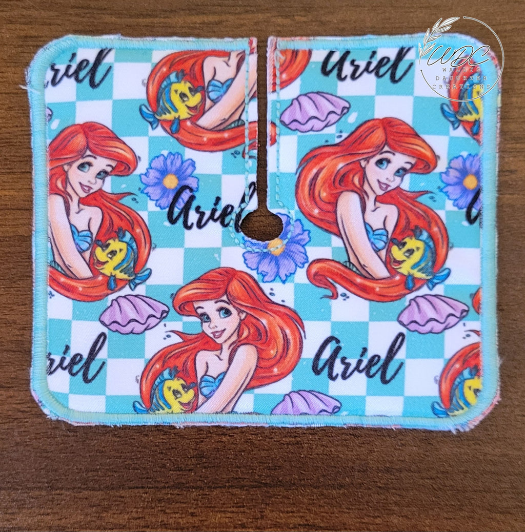 Trach pad with mermaid character and fish