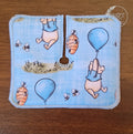 Trach pad with bear character and honey bees on blue