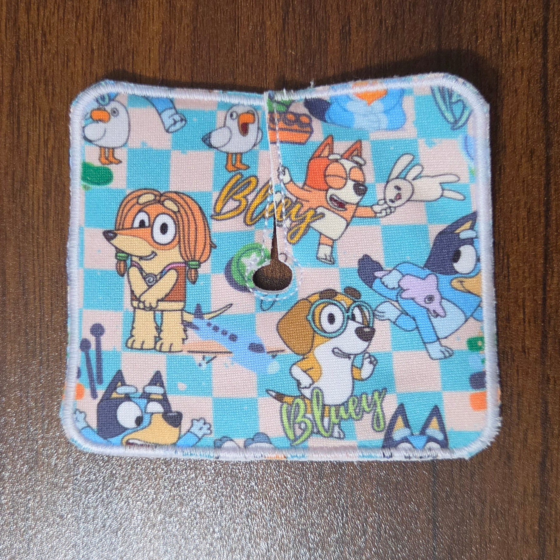 Aussie dog show characters on a blue and tan checkerboard background