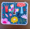 Trach pad with florals, butterflies, and mushrooms