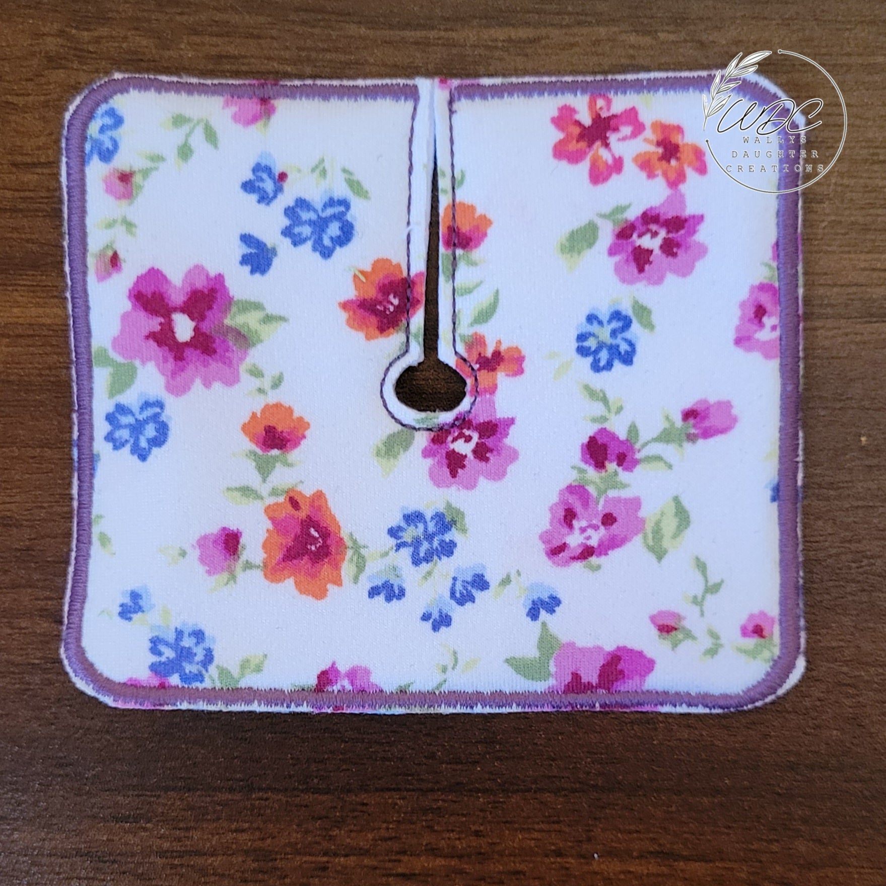 Trach pad with purple, blue and red florals on white background