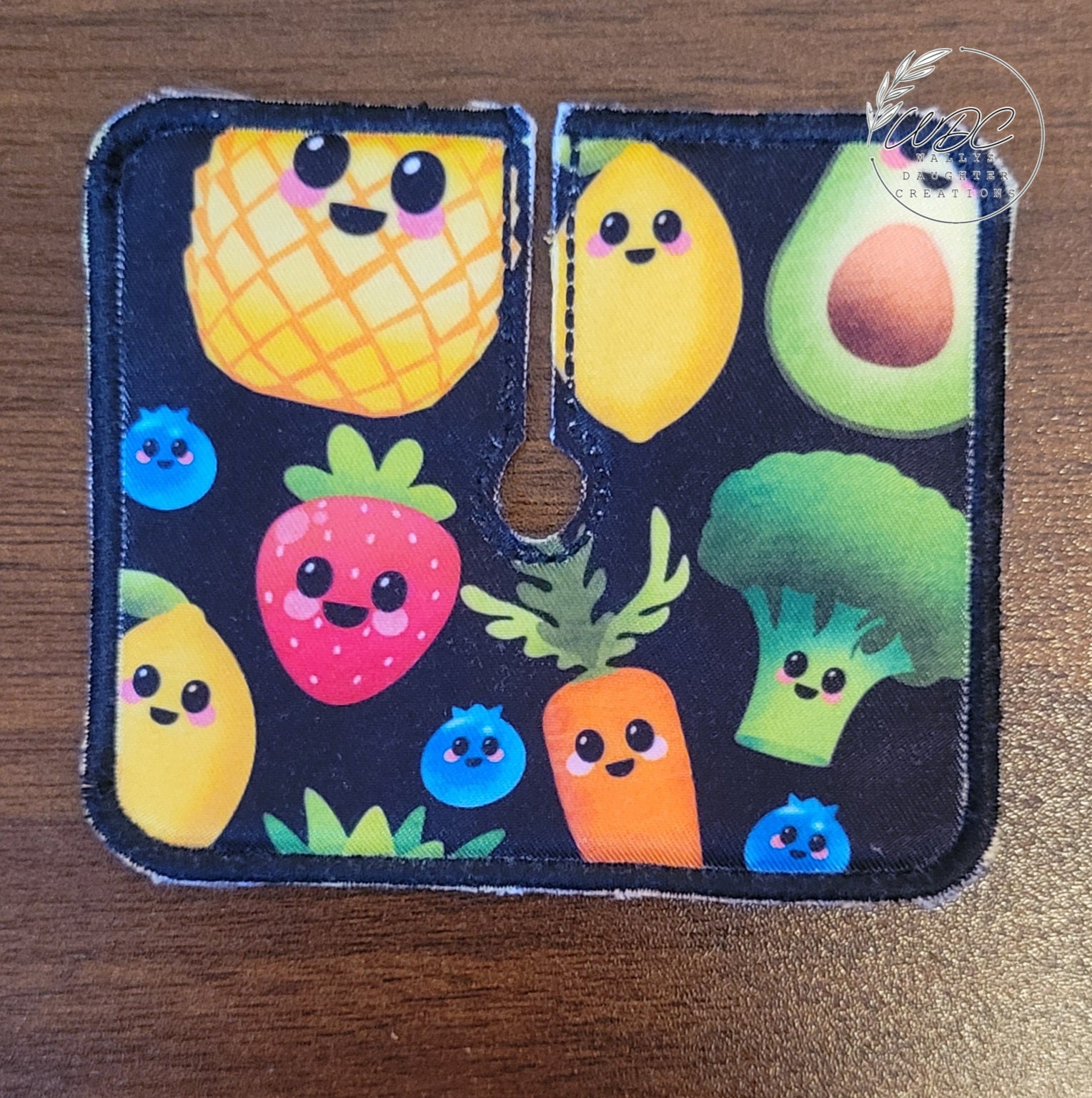 Trach pad with smiling fruit and vegetables on black background