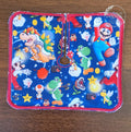 Trach pad with game characters from plumber game on blue background