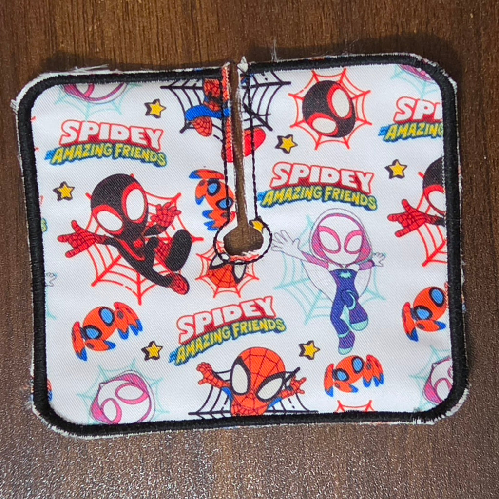 Trach pad with spider guy print