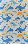 Sublimated Hypafix tape with dolphins and rainbows on white background