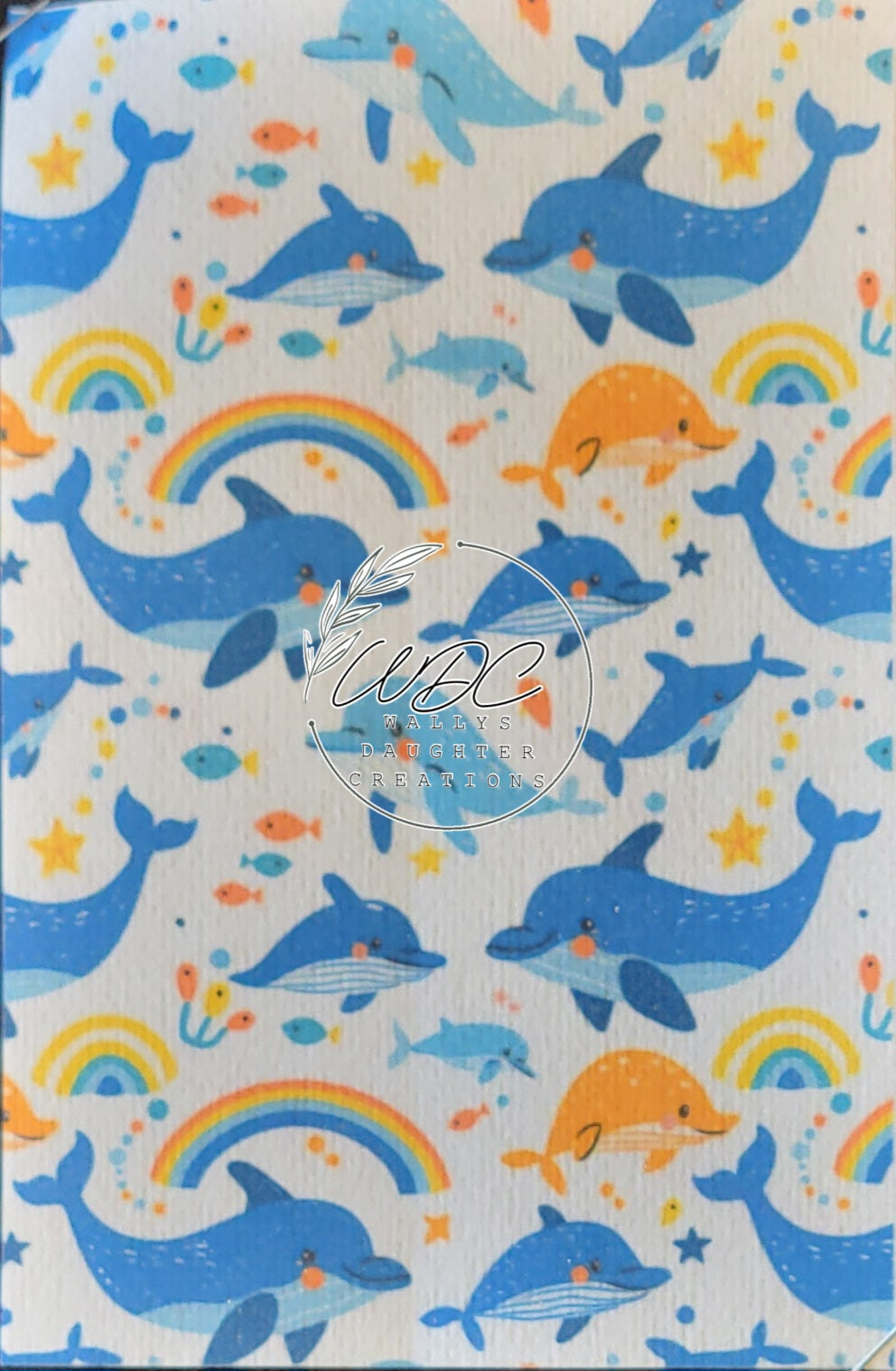Sublimated Hypafix tape with dolphins and rainbows on white background