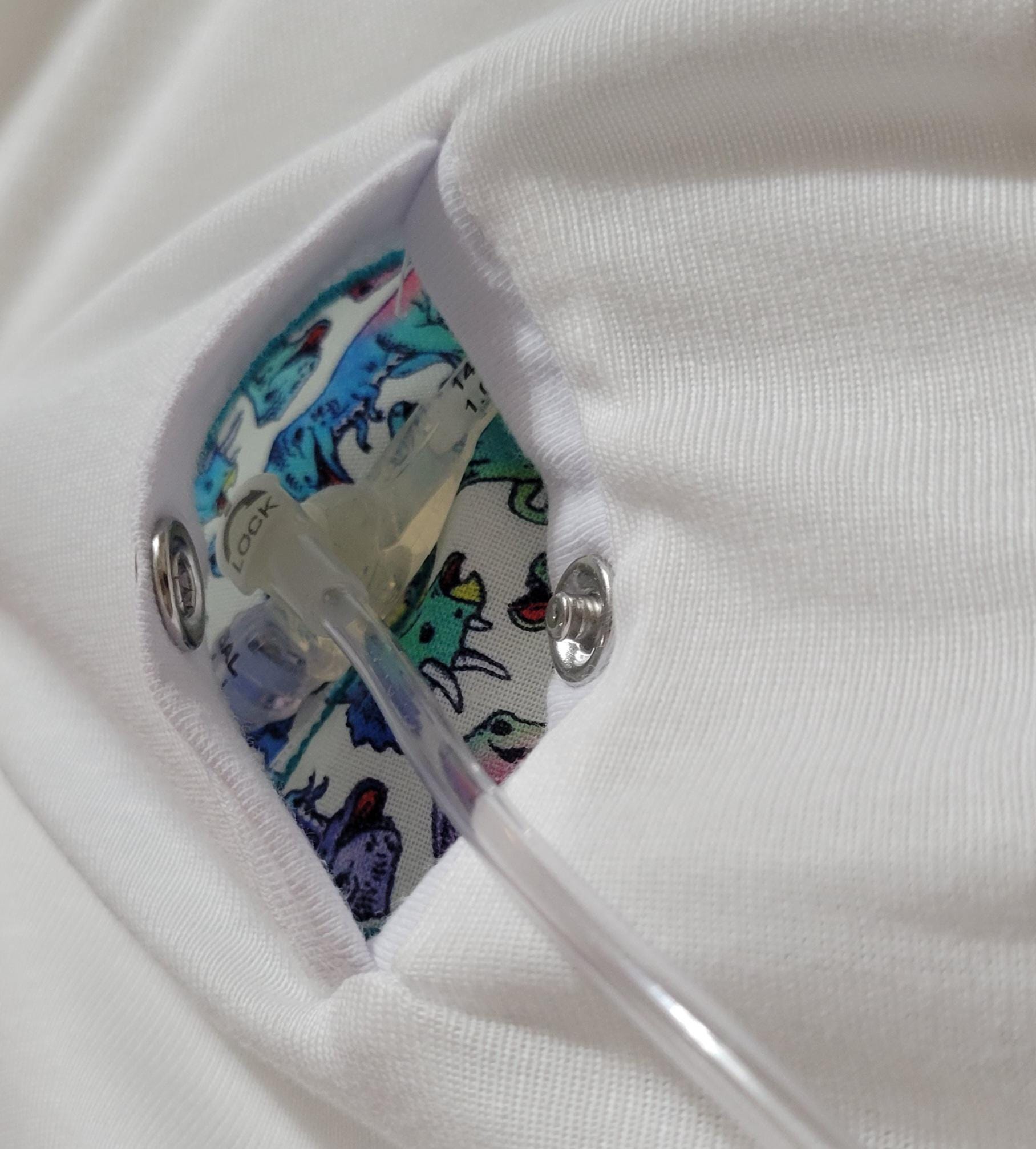 Close-up of a white garment with colorful patterned lining