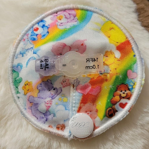 Colorful gtube pad with cartoon characters on a white fluffy surface