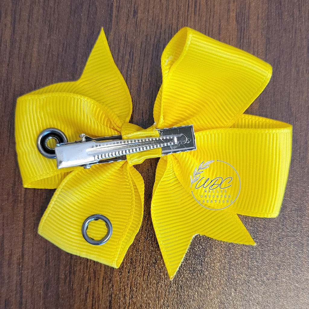 Back view of hair bow showing the snaps and the clip