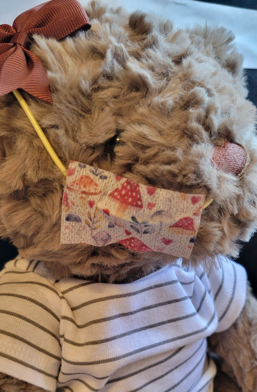 Brown Stuffy bear showing NG tape and bow