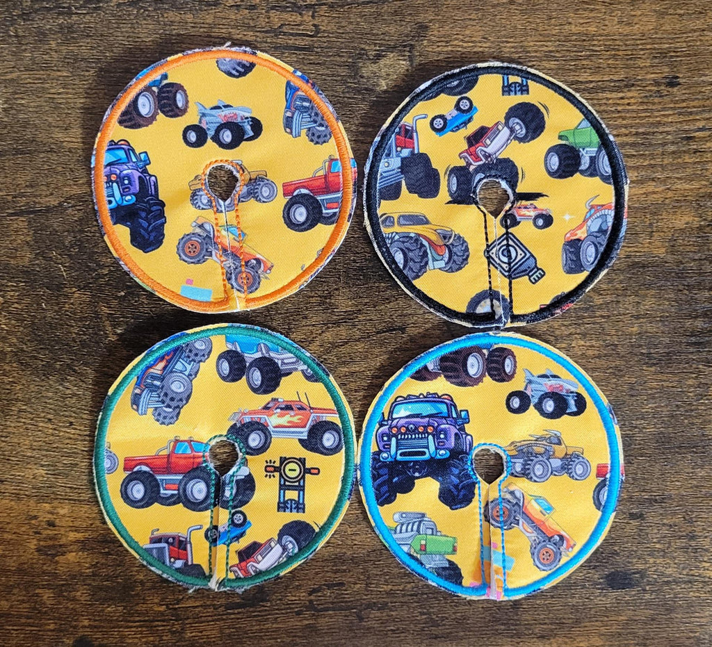 set of 4 gtube pads showing monster trucks on yellow background
