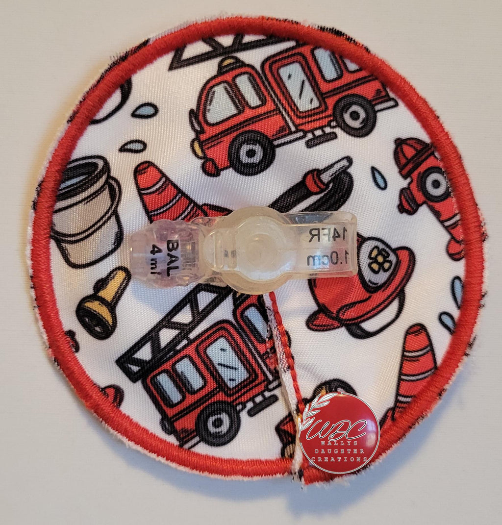 Gtube pad with firetruck characters around a mini button